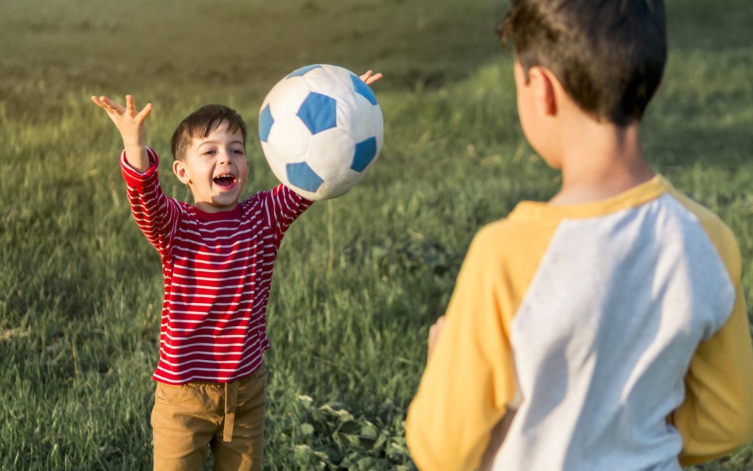 kids-playing-with-ball-outdoors
